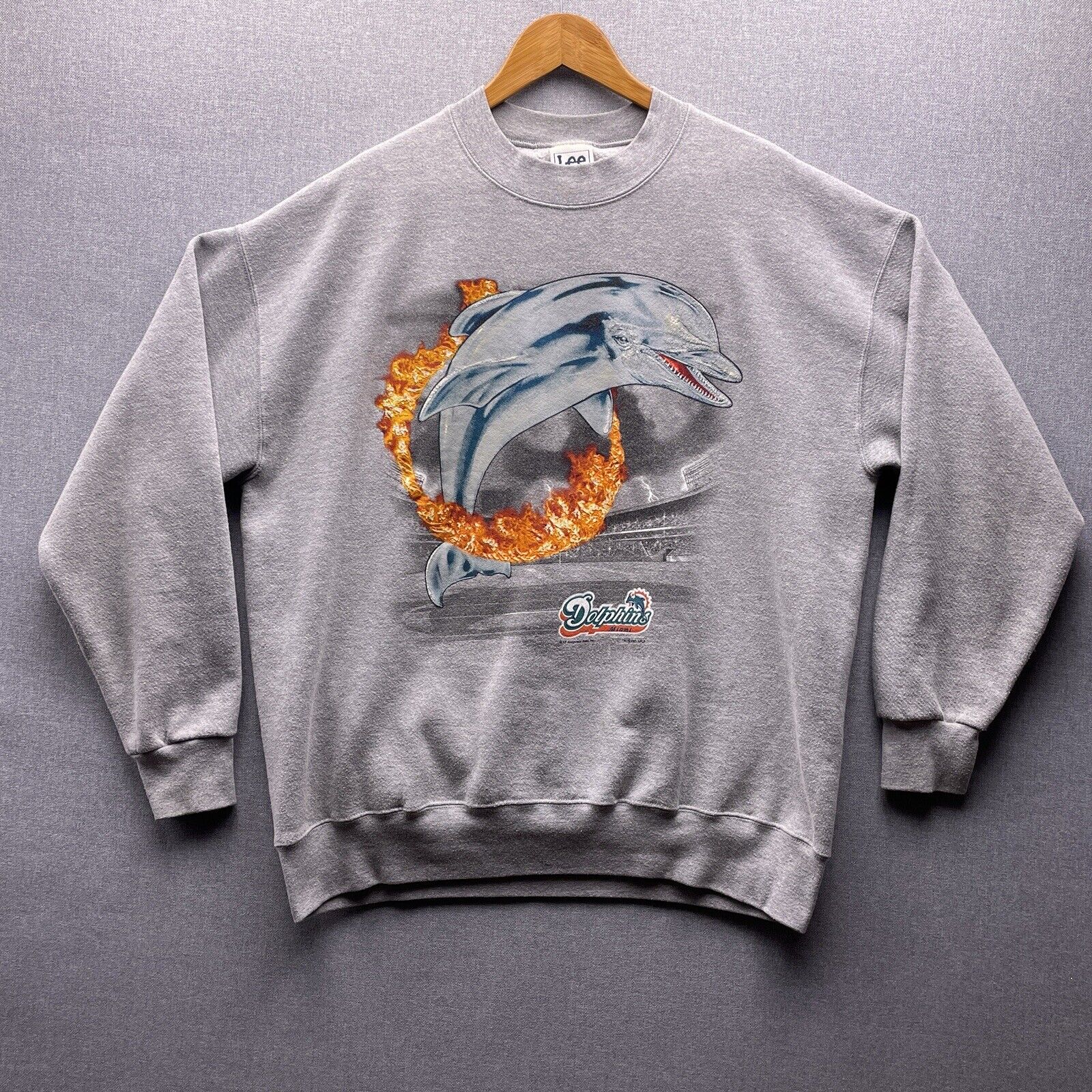 Top 20 Wonderful Miami dolphins Chisrtmas Themed Gifts For Sports fan Miami Dolphins Flame Hoop Graphic NFL Crewneck Sweatshirt