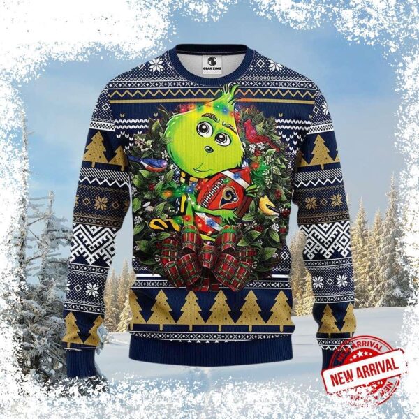 Spread holiday cheer with this hilarious Los Angeles Rams Grinch Holding Football Ugly Xmas Sweater! Perfect for game day or any festive gathering. Shop now and get ready for the season! - Image 1 - rugbyfanstore.com