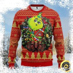 Show your 49ers pride this holiday season with this hilarious Grinch-themed ugly Christmas sweater! Featuring the Grinch holding a football wreath, this sweater is perfect for game day or any festive - Image 1 - rugbyfanstore.com