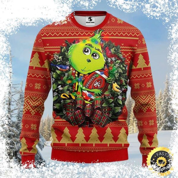 Show your 49ers pride this holiday season with this hilarious Grinch-themed ugly Christmas sweater! Featuring the Grinch holding a football wreath, this sweater is perfect for game day or any festive - Image 1 - rugbyfanstore.com