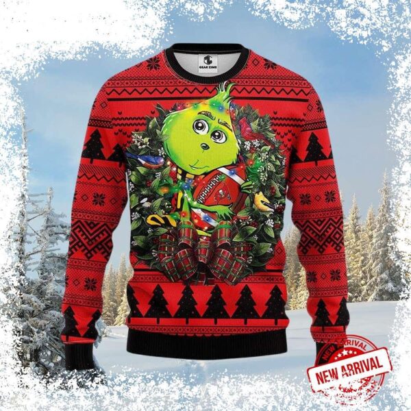 Show your Tampa Bay Buccaneers pride this Christmas with this hilarious Grinch in Wreath Ugly Christmas Sweater! Perfect for holiday parties or casual wear, this sweater is sure to get laughs. Shop no - Image 1 - rugbyfanstore.com