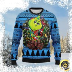 Show your Carolina Panthers pride this holiday season with our hilarious Grinch with Wreath ugly Christmas sweater! Perfect for game day or holiday gatherings, this sweater is sure to get you noticed. - Image 1 - rugbyfanstore.com