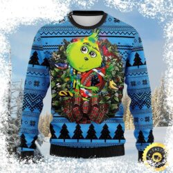 Show your Carolina Panthers pride this Christmas with this unique sweater featuring a Grinch football wreath design. Shop now and get ready to cheer on your team in style! - Image 1 - rugbyfanstore.com