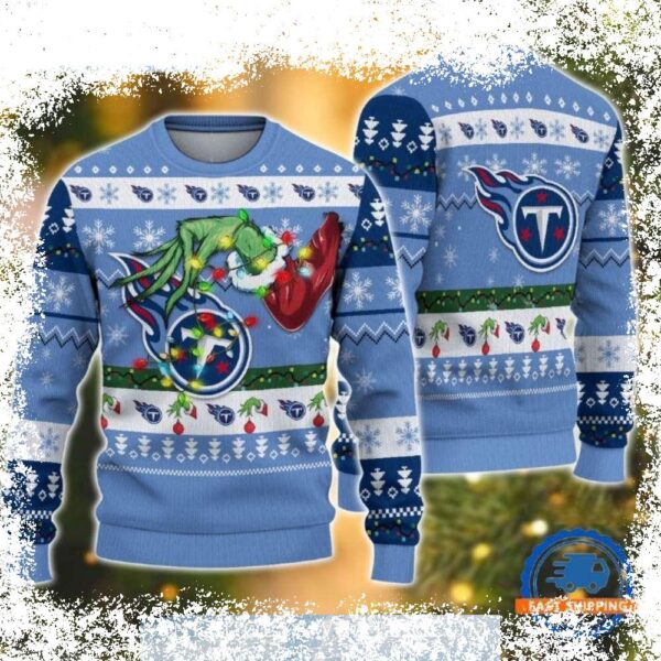 Show your Titans pride this Christmas with our hilarious Grinch sweater! Perfect for ugly sweater parties, this festive design features the Grinch in Titans colors. Shop now for a unique and funny g - Image 1 - rugbyfanstore.com