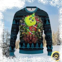 Show your Jacksonville Jaguars pride this Christmas with our adorable Grinch-themed ugly Christmas sweater! Get yours now and spread some holiday cheer! - Image 1 - rugbyfanstore.com