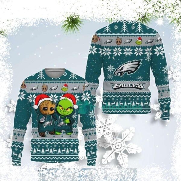 Show off your festive spirit with this adorable NFL Baby Groot and Grinch best friends Eagles ugly Christmas sweater! Perfect for any Eagles fan, this sweater is sure to bring smiles and laughs. Shop - Image 1 - rugbyfanstore.com